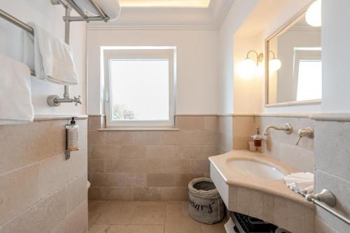 a bathroom with a sink and a mirror at Villa DAlessandro in Anacapri