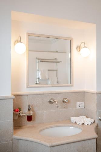 a bathroom with a sink and a mirror at Villa DAlessandro in Anacapri