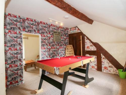a room with a ping pong table in it at The Laurels in Bishops Castle