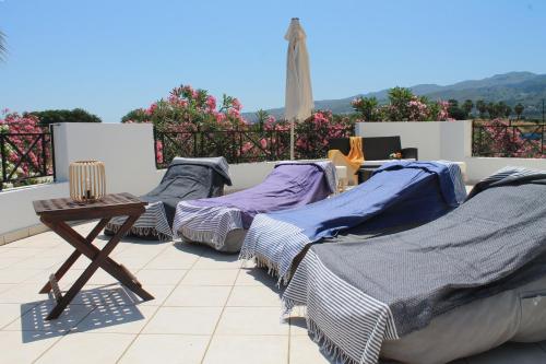 a group of beds sitting on top of a roof at Villa Aphrodity in Kos Town