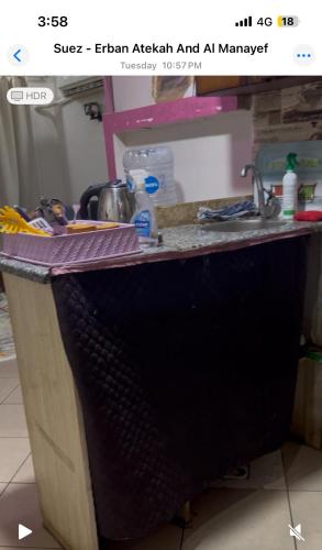 a kitchen counter with a counter top with a sink at Chalet in Ain Sokhna
