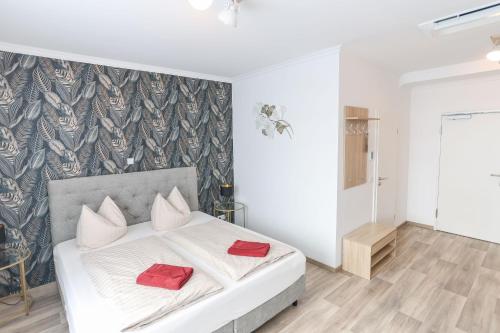 Postel nebo postele na pokoji v ubytování Second Home Hotel