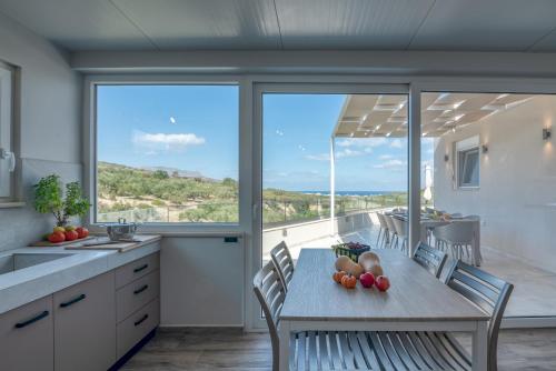 a kitchen with a table with fruit on it at Casa Elea in Kissamos
