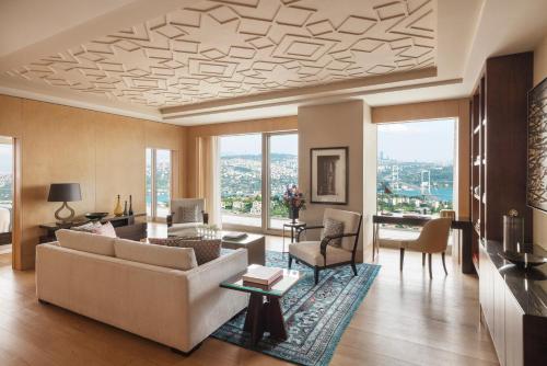 a living room with a couch and a table at Raffles Istanbul in Istanbul