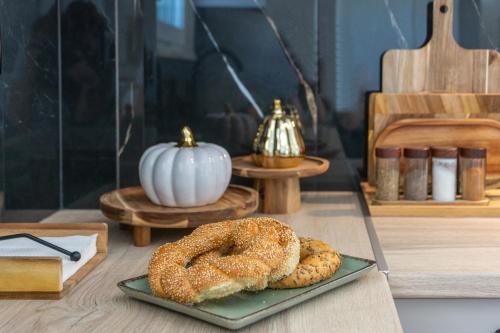 a plate with two bagels and a pumpkin on a table at Casa Elea in Kissamos