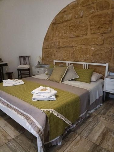 a bedroom with two beds with towels on them at Zabbara in Agrigento