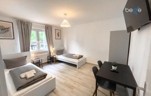 a living room with a couch and a table at BEGE APARTMENTS: PERFECT FOR COMPANIES in Gelsenkirchen