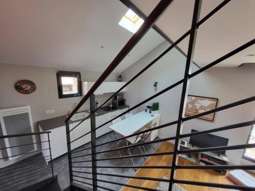 a view from the top of a staircase in a house at Le Loft de Genas - l'Atelier et la Villa in Genas