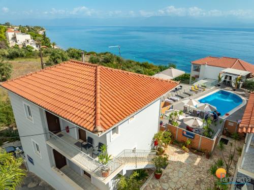 an aerial view of a house with a swimming pool at Panorama Apartments in Chrani