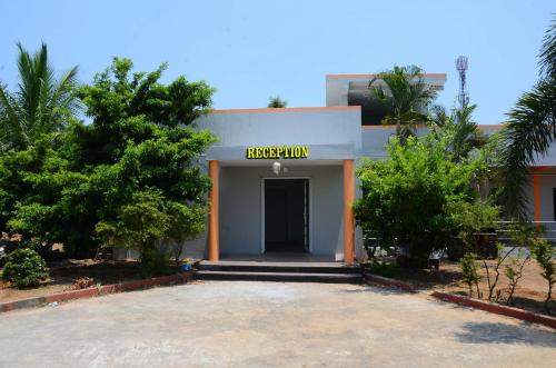 a building with a sign that reads hospitalium at yatri nivas tada in Tada
