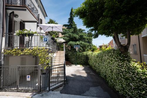 a gate with an umbrella next to a building at B&B A Portata di Mare in Loreto