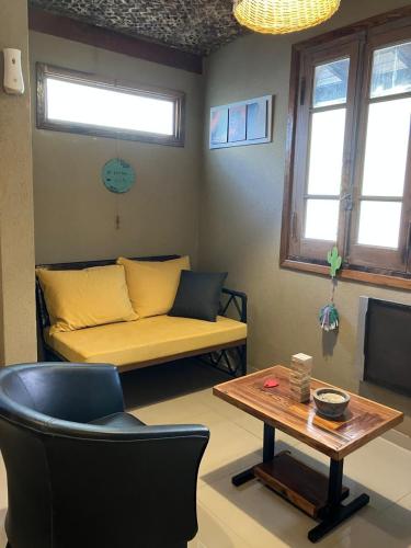 a living room with a couch and a table at Modern apartment in San Fernando in San Fernando