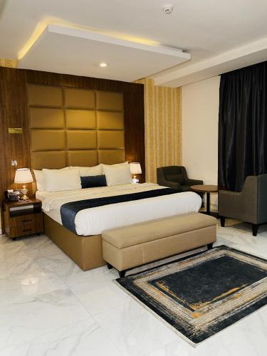 Postel nebo postele na pokoji v ubytování De Palms Hotel Port Harcourt