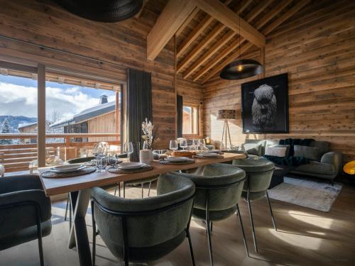 a dining room with a table and chairs at Le Valais Nook - OVO Network in Les Gets