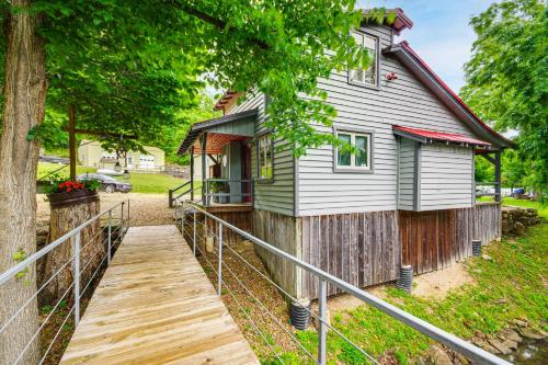 a wooden walkway leading to a house at Hike, Swim and Fish Lakefront Cabin in Roach! in Roach