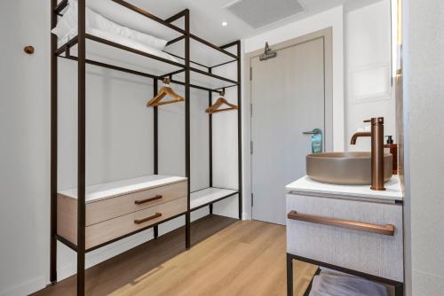 a bathroom with a sink and a mirror at Valentin Grand Park Suite Hotel in Paguera