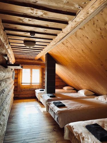 a room with a row of bunk beds in it at Järveveere Puhkekeskus in Valma
