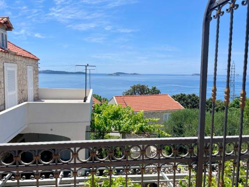 a view of the ocean from a balcony at Apartments Grbic in Mlini