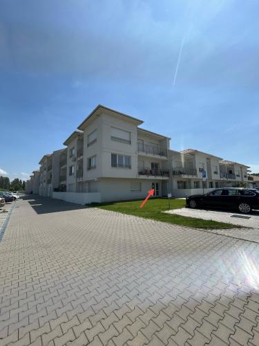 an empty parking lot in front of a building at Apartman Hanna in Dunajská Streda