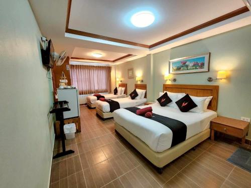 Ένα ή περισσότερα κρεβάτια σε δωμάτιο στο Chilli Hotel&Restaurant