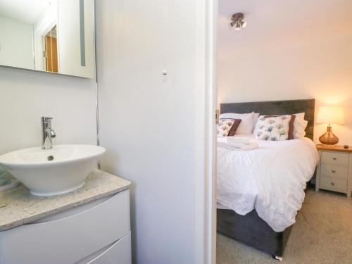 Ένα ή περισσότερα κρεβάτια σε δωμάτιο στο Dovedale Lodge