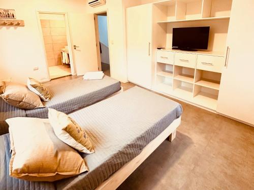 TV o dispositivi per l'intrattenimento presso CASA TOSSA en Solanas Vacation Club