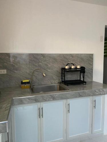 a kitchen with a sink and a counter top at Casa Tres16 Quality Cheap WI-FI in Pilar