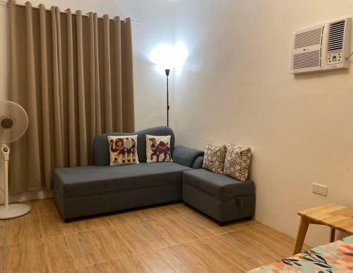a living room with a couch and a chair at Casa Tres16 Quality Cheap WI-FI in Pilar