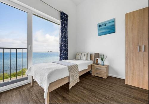 Cama o camas de una habitación en Ferienwohnung Admiral Suite