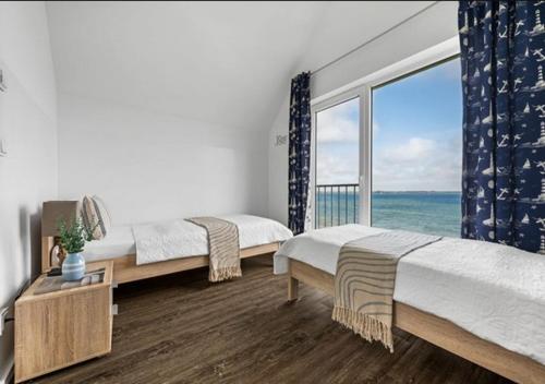 Postel nebo postele na pokoji v ubytování Ferienwohnung Admiral Suite