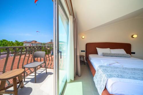 Postel nebo postele na pokoji v ubytování Magic Tulip Beach Hotel
