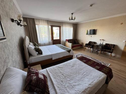 Postel nebo postele na pokoji v ubytování Hotel Ipekyolu