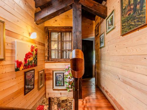 a hallway in a cabin with wooden walls at Chalet Baita Ballardini by Interhome in Ragoli