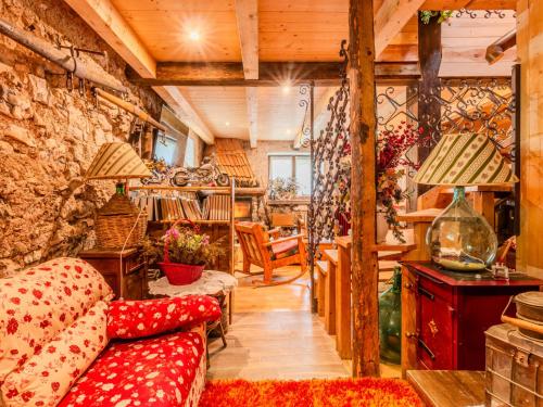 a living room with a couch and a table at Chalet Baita Ballardini by Interhome in Ragoli