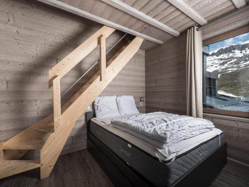 Posteľ alebo postele v izbe v ubytovaní Duplex rénové, skis aux pieds, balcon, proche commerces, 8 pers, animaux acceptés - FR-1-502-466