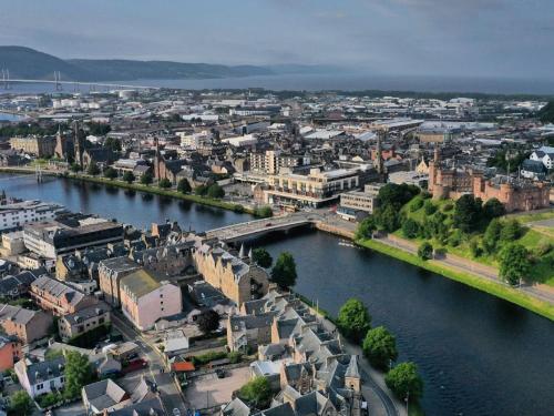 an aerial view of a city with a river at Holiday Home Lochness by Interhome in Contin