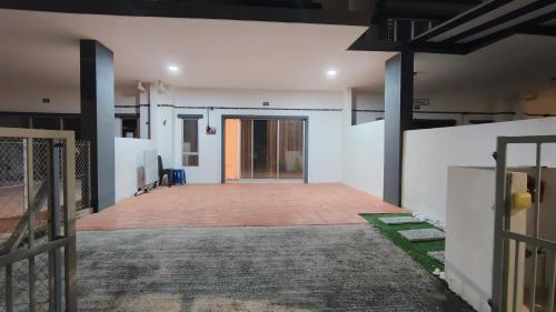 an empty hallway of a building with a gate at Homestay 641 Mu5lim only in Port Dickson