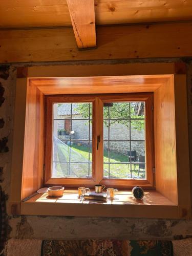 a window in a cabin with a view of a yard at Ranch below Ostrog 