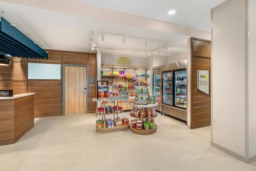a store with a display of shoes and other items at Home2 Suites By Hilton Bozeman Four Corners in Bozeman