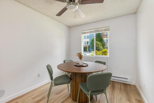 a dining room with a table and chairs at Comfortable Townhouse in Ash Way Lynnwood in Lynnwood