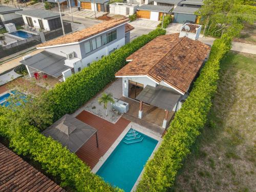 an overhead view of a house with a swimming pool at Playa Tamarindo, CasaMar de Tamarindo in Tamarindo