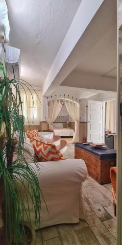 a living room with two beds and a pool table at Mon Ilıca Otel in Çeşme