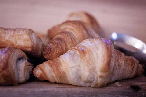 a group of croissants sitting on top of a table at Rectory Farm in Cambridge