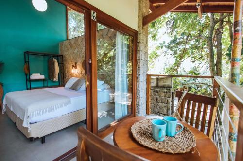 Cama ou camas em um quarto em Smart Hotel Reserva Ilhabela