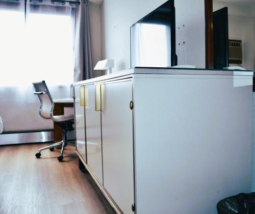 TV a/nebo společenská místnost v ubytování American Motel Waseca
