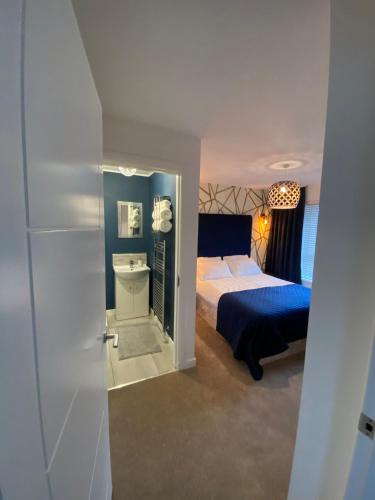 a bedroom with a bed and a toilet in it at Entire Spacious 3-Bed Family Home, City Centre, Free Parking, Garden in Glasgow