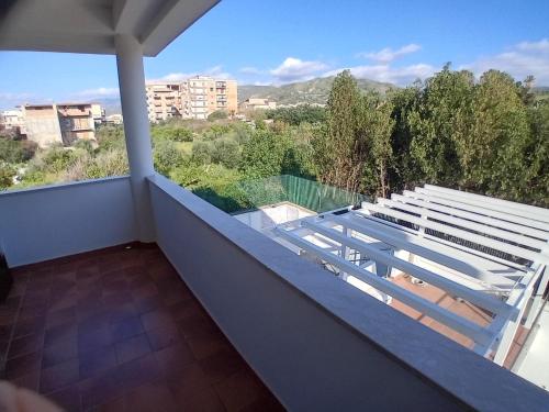 a balcony with a white bench on top of it at Carachouse Pellaro in Pellaro