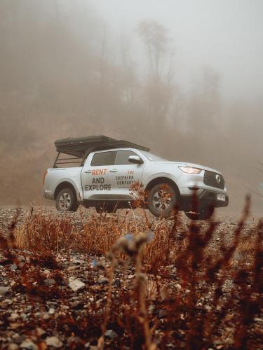 a truck parked on a dirt road in the fog at Camper camioneta equipada cajon del maipo in San José de Maipo