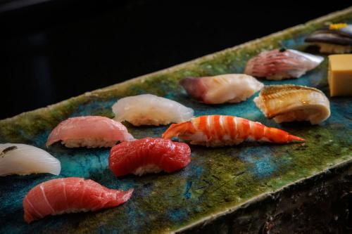 a bunch of different types of seafood on a table at The Westin Tokyo in Tokyo