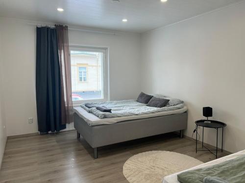 Postel nebo postele na pokoji v ubytování Antinkatu kaksio, As1